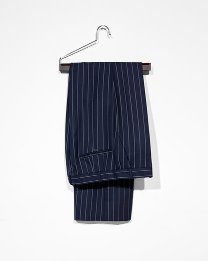 Navy pinstripe suit pants on a hanger against a white background