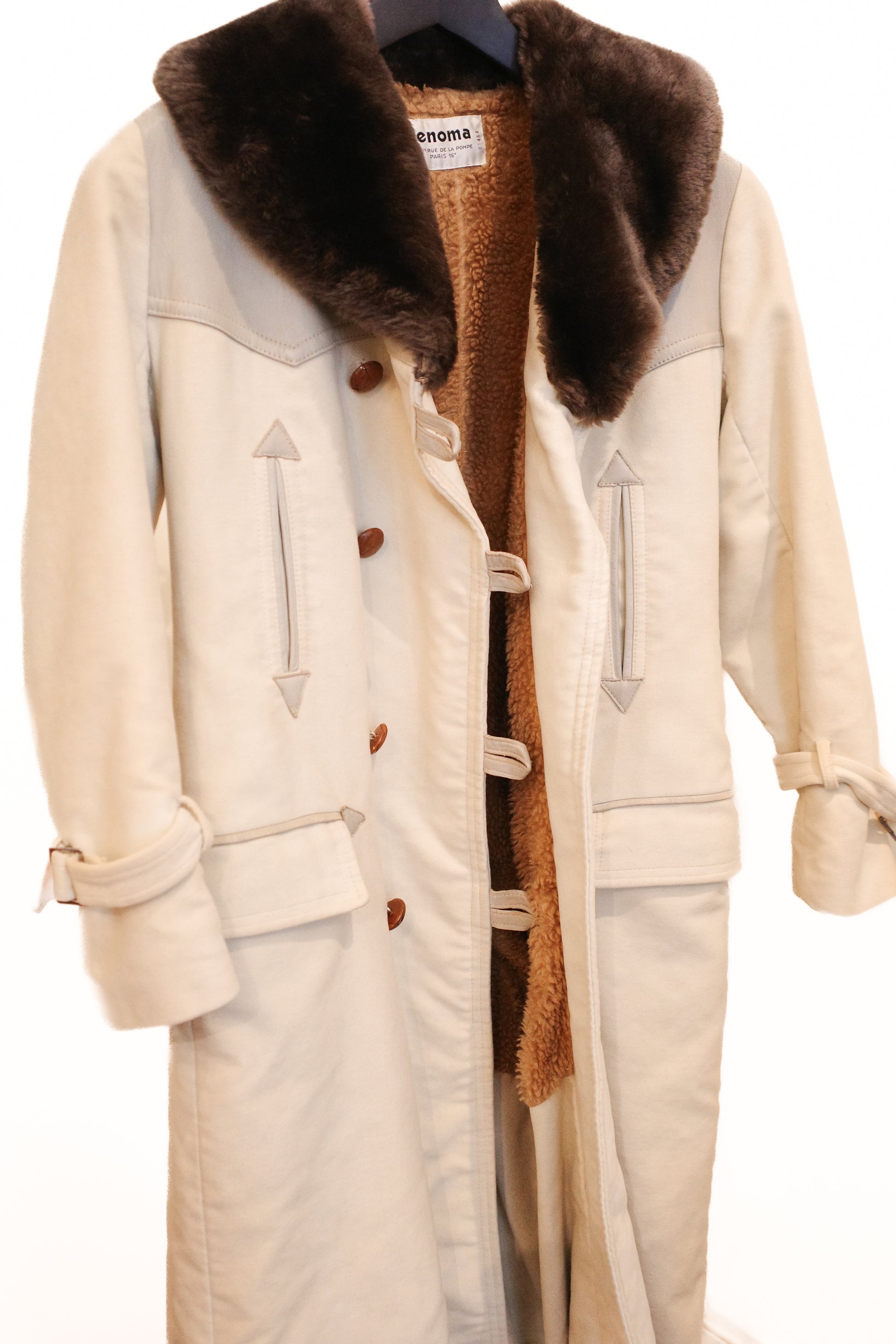 Side view of Renoma vintage car coat, cream with brown fur collar, double-breasted with arrow detail buttons