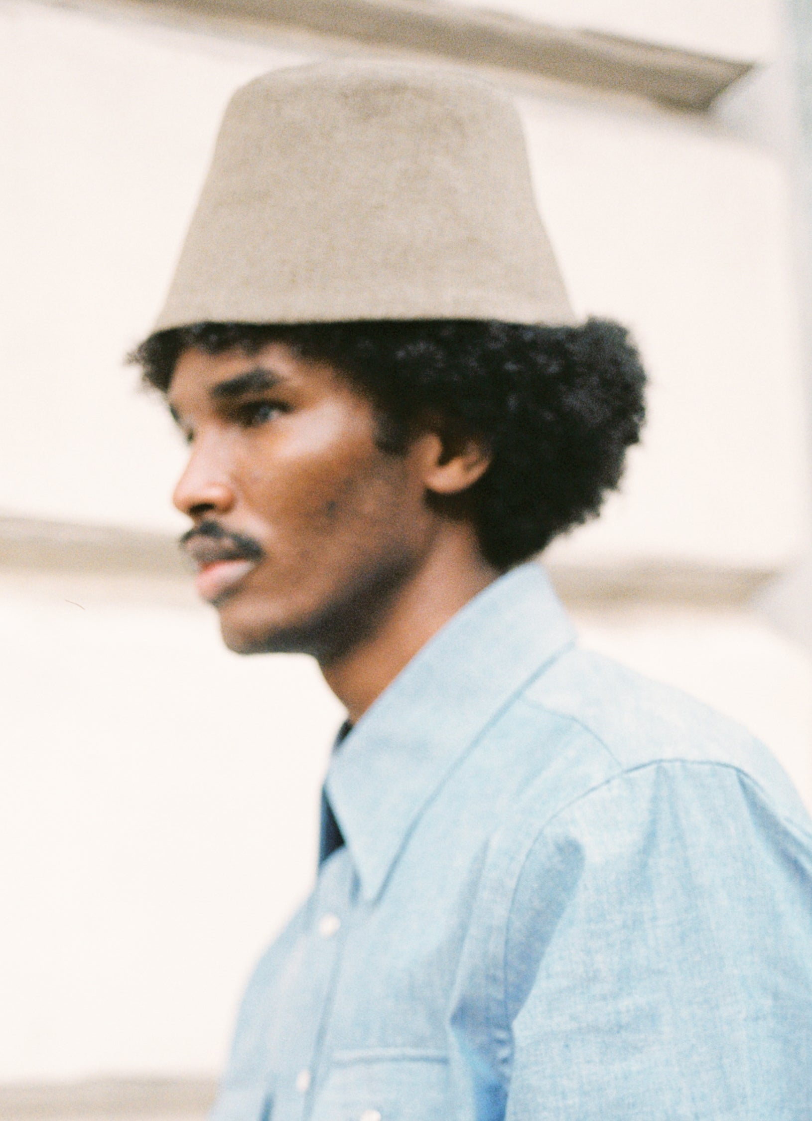 Biboja Kapa hat in greenish beige wool with black pinstripe lining